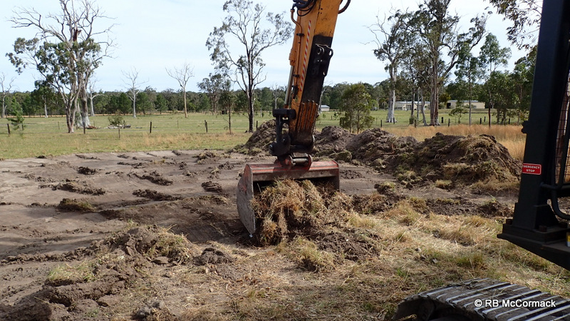 Removing the first 100-150 mm of grass and topsoil
